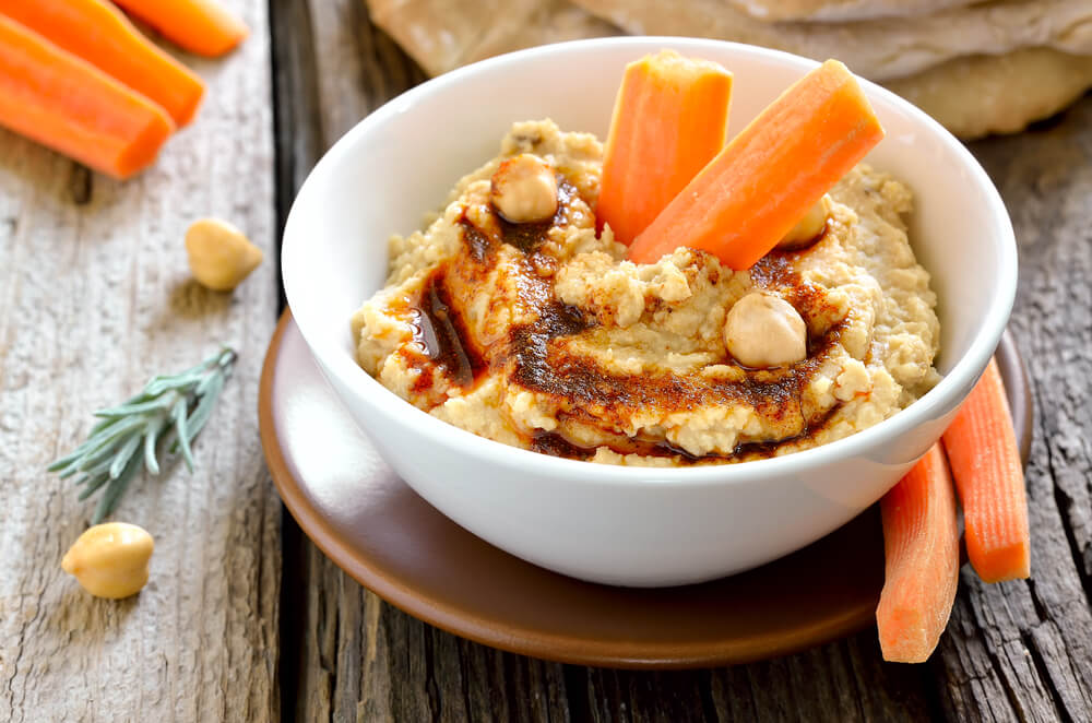 Bowl of carrot and hummus 