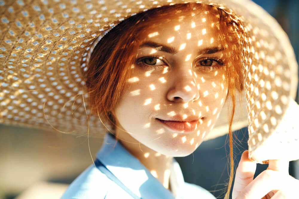 Closeup of woman in oversized sun hat