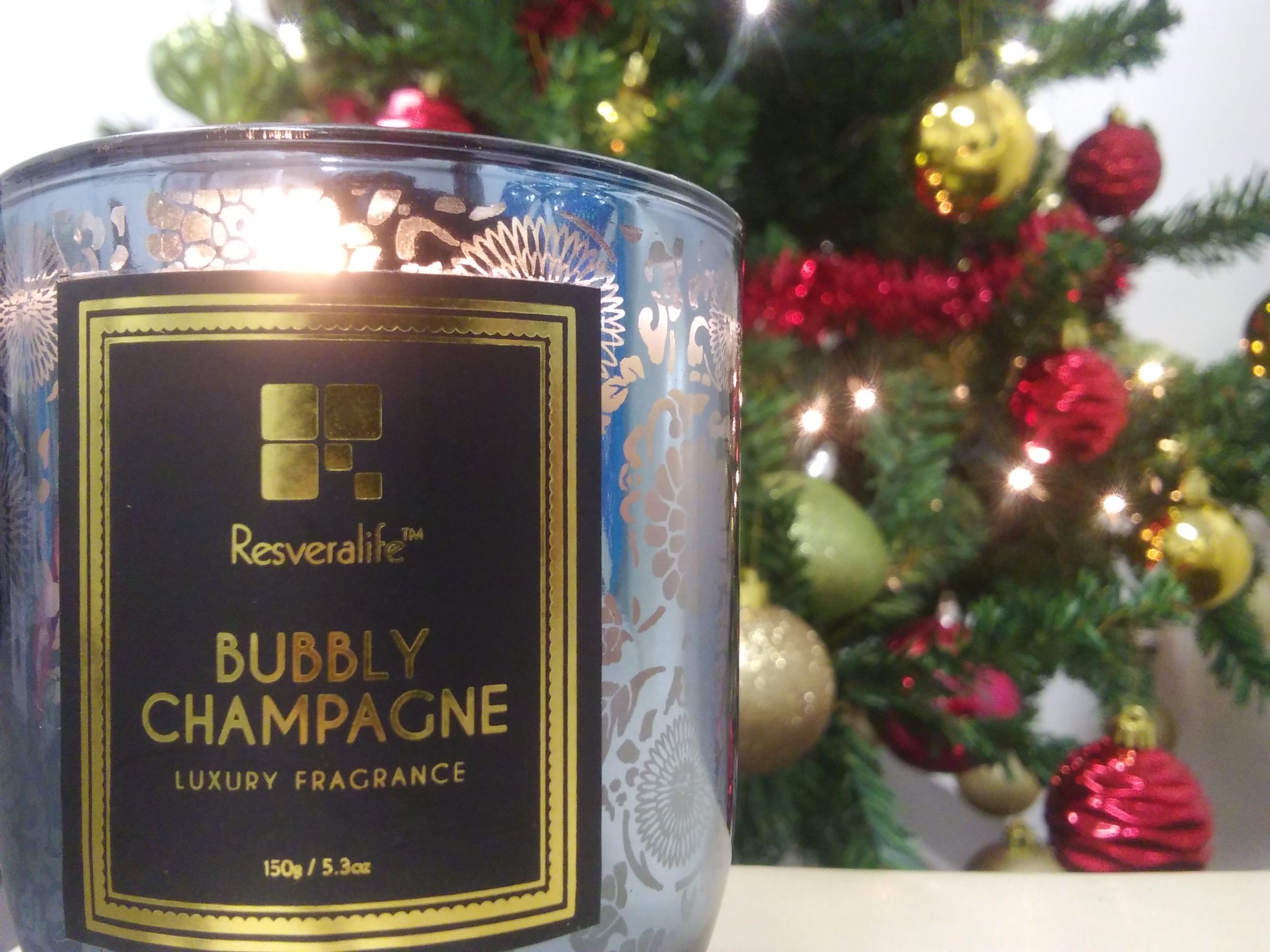 Resveralife Bubbly Champagne Candle in holiday setting