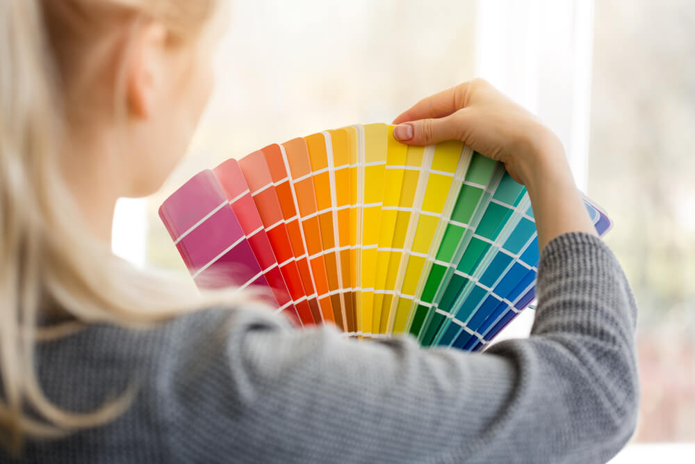 Woman choosing color swatches