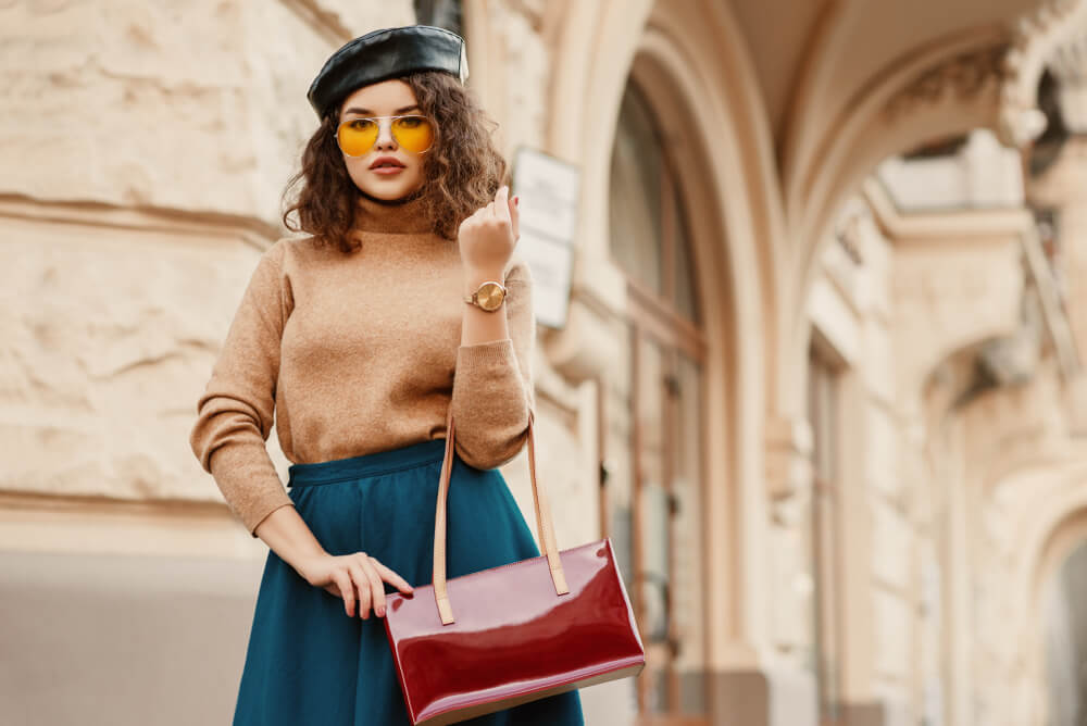 Stylish woman with hat and baguette handbag