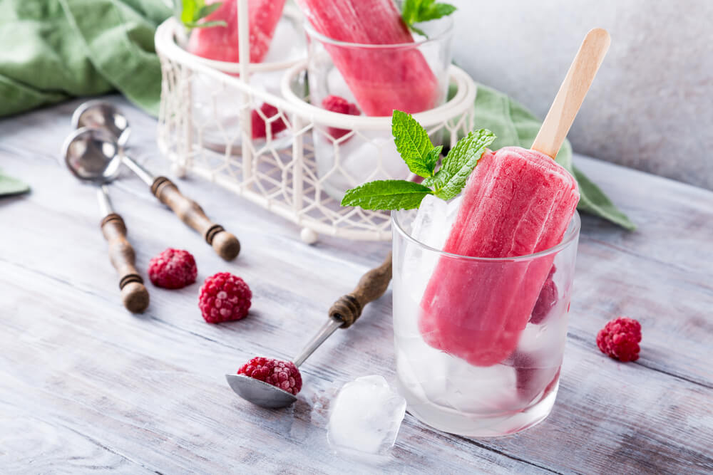Homemade popsicles with raspberries