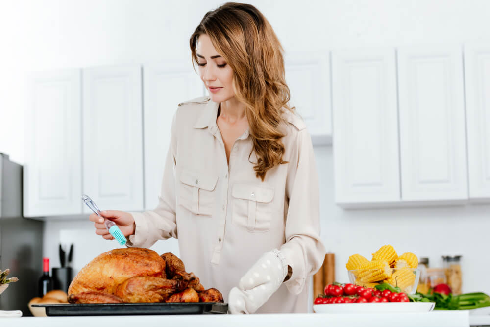 Woman cooking turkey