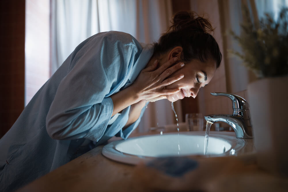 woman washing face