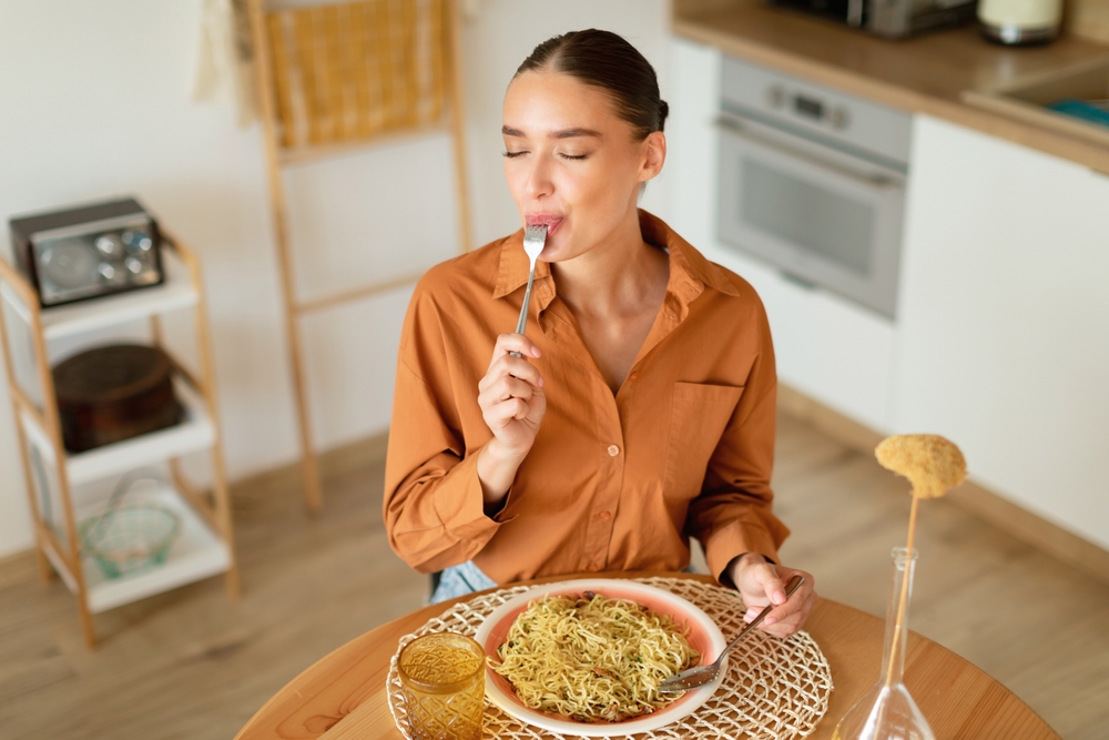 Woman eating a nice dinner at home